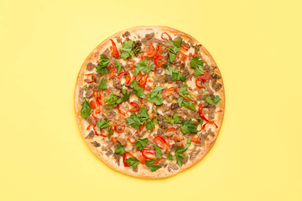 istock Flat lay delicious pizza isolated on bright yellow background with a copy space 1211561382