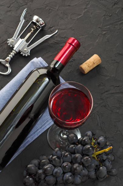 istock Top view on glass with wine and grapes 1211563131
