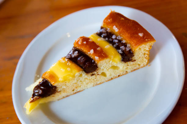 Sweet lemon cake pastry in cafe and bakery. Delicious Fresh baked desert with chocolate at patisserie. Homemade biscuit cake food for breakfast. Gourmet and cuisine for catering. Background with table