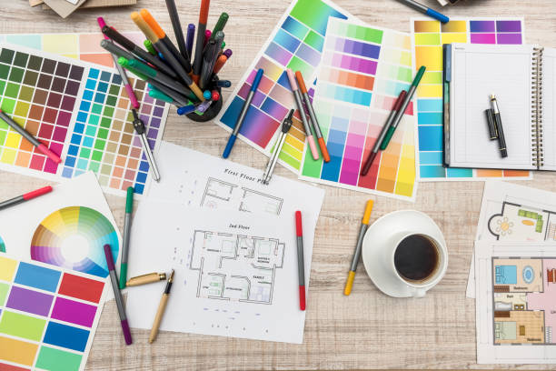 istock Top view of architectural blueprints  with material sample on creative desk 1211565238