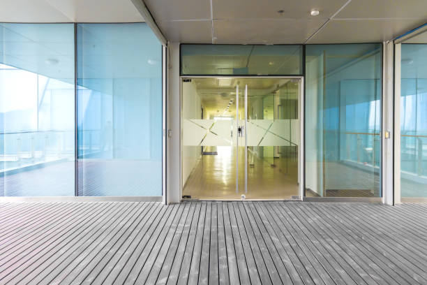 istock A modern office building with glass doors and windows 1211566917