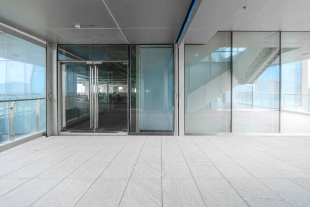 istock A modern office building with glass doors and windows 1211567027