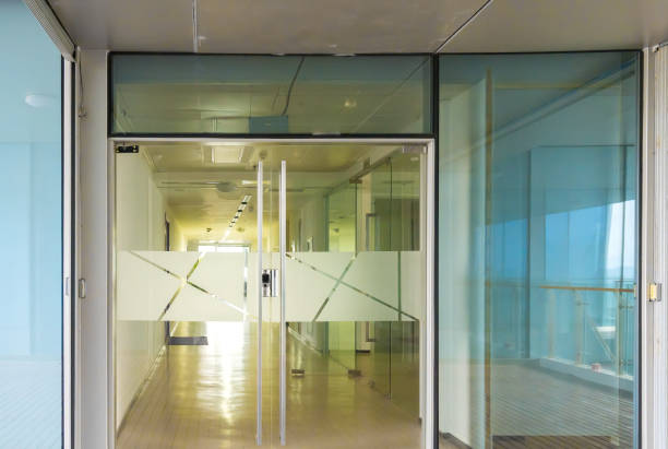 istock A modern office building with glass doors and windows 1211567042