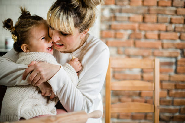 istock Mother and daughter in the kitchen 1211570996