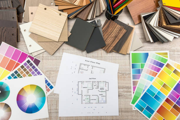 istock architectural blueprints with paper and wooden color sampler on creative desk 1211571586