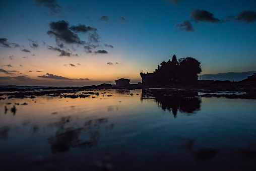 Tanah Lot temple with reflection after sunset