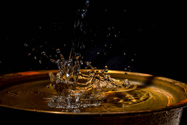 istock A stream of water flows into the copper wash basin 1211573148