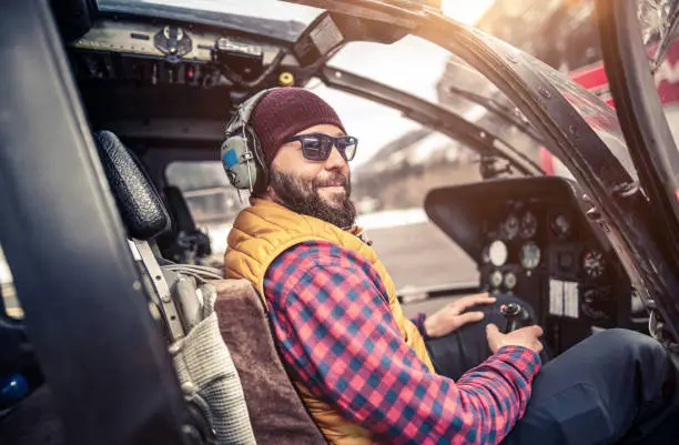 Photo of Man inside a helicopter cabin