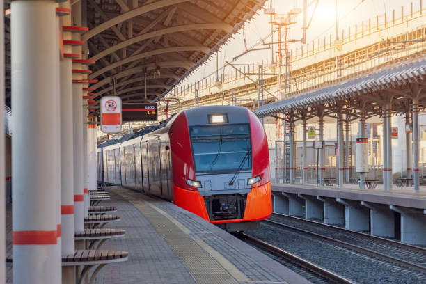 istock Passenger electric subway train arrives at a platform with benches for people. 1211573942