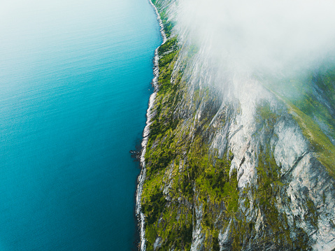 Drone panoramic photo of dramatic mountain summer landscape with beautiful cliffs, sea and lakes on Senja island, Northern Norway