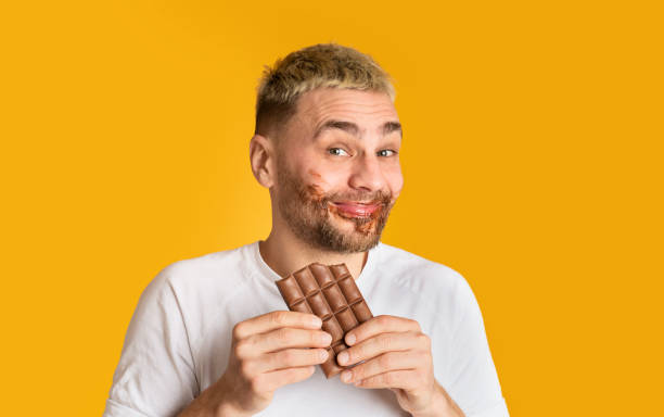 istock Sweet tooth smeared with chocolate and smiling 1211577999