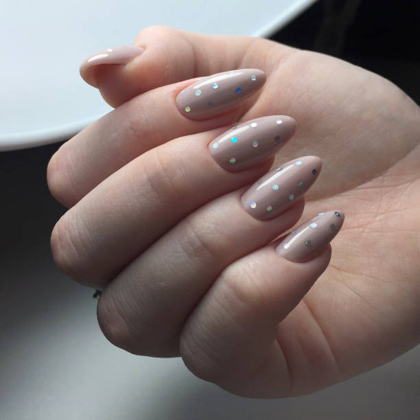 istock stylish design of manicure on long beautiful nails 1211582994