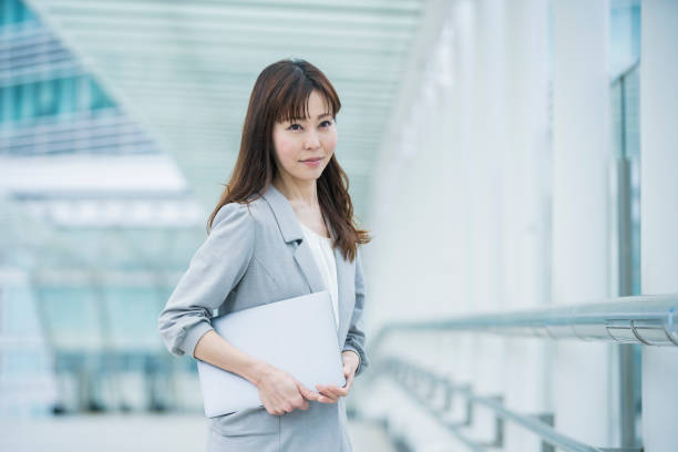 istock Career woman in business district 1211586043