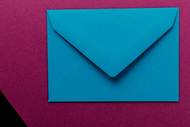 istock Colorful envelope on a purple background. 1211587490