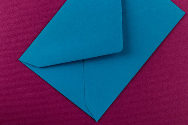 istock Colorful envelope on a purple background. 1211587500