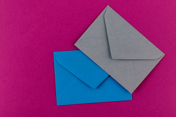 istock Colorful envelopes on a purple background. 1211587861