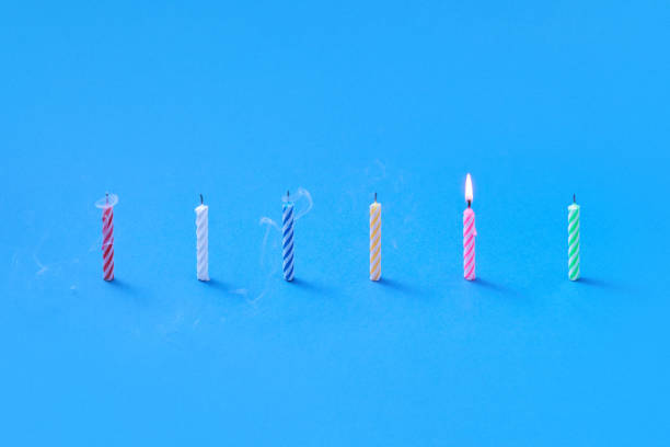 istock Creative composition from candles for cakes and sweet dessert. 1211587911