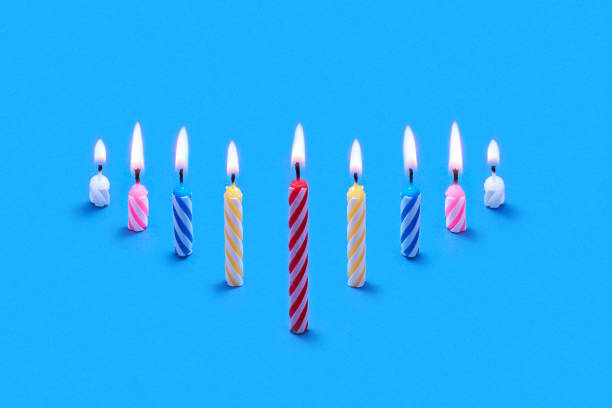 istock Perspective composition from burning festive candles for cakes. 1211587959