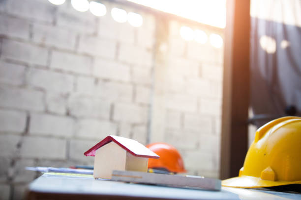 istock Architect desk concept,construction site working with blueprints in the office.Home Project to Offer Management 1211589816