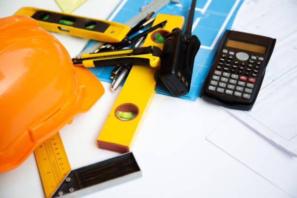 istock Architect desk concept,construction site working with blueprints in the office.Home Project to Offer Management 1211589839