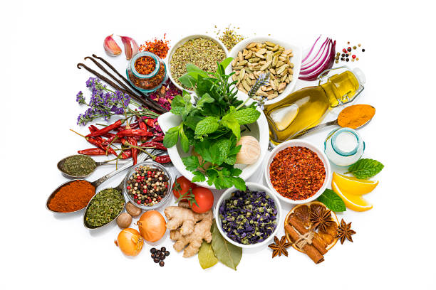 cooking and seasoning ingredients: vegetables, herbs and spices on white background - mortar and pestle condiment isolated food imagens e fotografias de stock