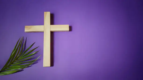 photo of wooden cross and palm leave stock photo