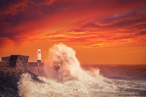 istock Porthcawl Lightouse and Waves at Sunset 1211592202