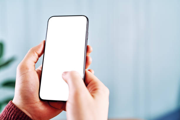 istock Woman holding and touching blank screen template smart phone. Smart phone screen is empty with clipping path. 1211593216