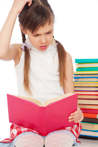 istock pensive young girl with books 121159476