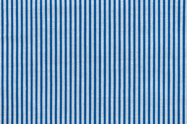 istock Classic blue and white striped fabric texture. Bright colored cotton background 1211595355