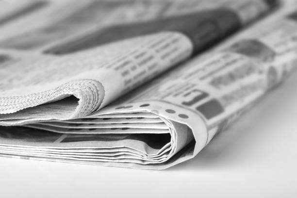 istock Newspapers on the table in the office. News concept 1211599513