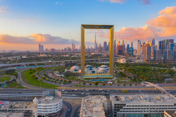 Aerial view of Dubai Frame, Downtown skyline, United Arab Emirates or UAE. Financial district and business area in smart urban city. Skyscraper and high-rise buildings at sunset. Aerial view of Dubai Frame, Downtown skyline, United Arab Emirates or UAE. Financial district and business area in smart urban city. Skyscraper and high-rise buildings at sunset. khalifa stock pictures, royalty-free photos & images