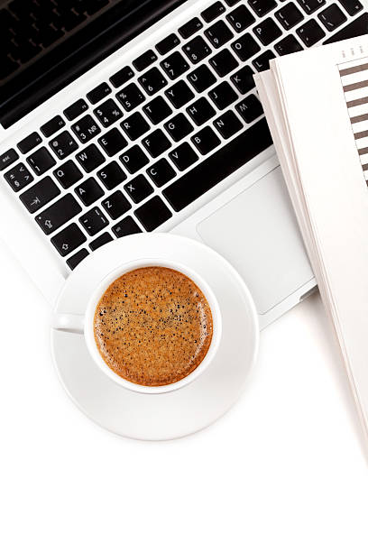 istock Cappuccino cup on laptop. Above view 121160110
