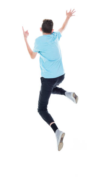 istock Caucasian boys jumping in front of white background 1211601211