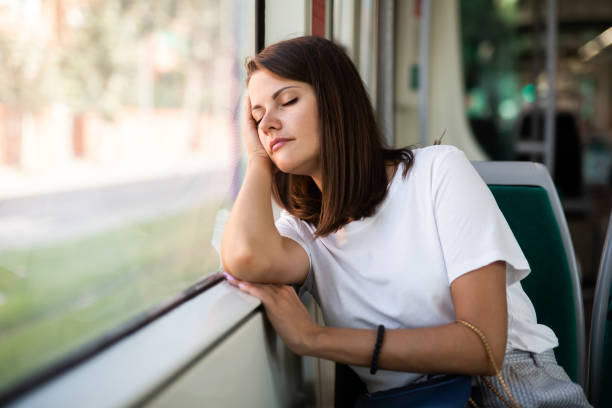 istock Woman sleeping in modern streetcar 1211601301