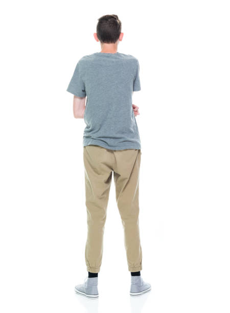 istock Caucasian male standing in front of white background 1211601367