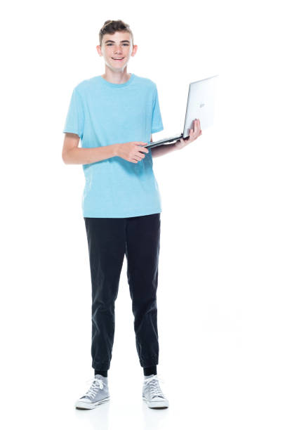 istock Caucasian teenage boys in front of white background and using computer 1211601552