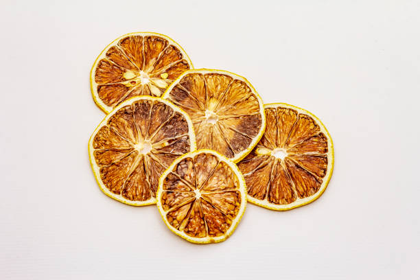 istock Dried slices of fruit isolated on white background 1211601827