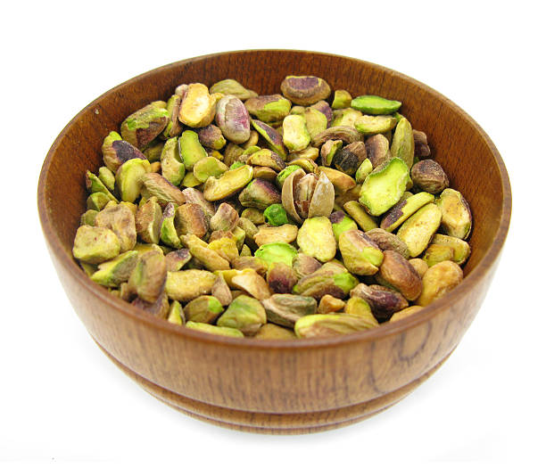 istock Pistachios in wooden dish 121160196