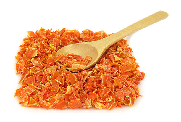 istock Carrot dried and chopped with wooden spoon 121160277