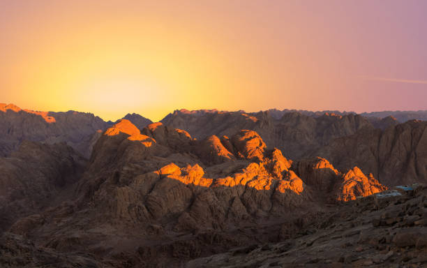 istock Beautiful view from the mountain. Panorama. Mountain range with visible silhouettes through the morning blue fog 1211603463