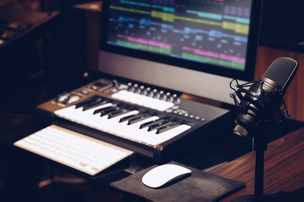 istock microphone, keyboard, computer on desk in home studio. music production concept 1211603697