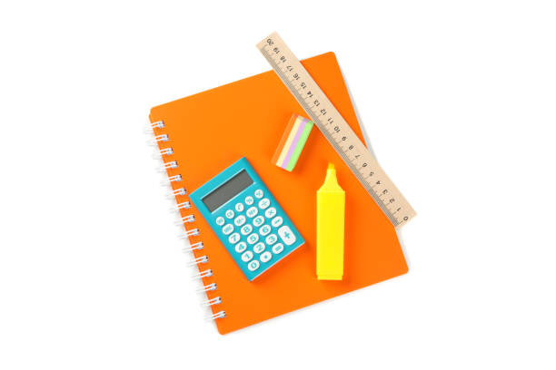 istock Copybook with calculator, marker, eraser and ruler isolated on white background 1211604353