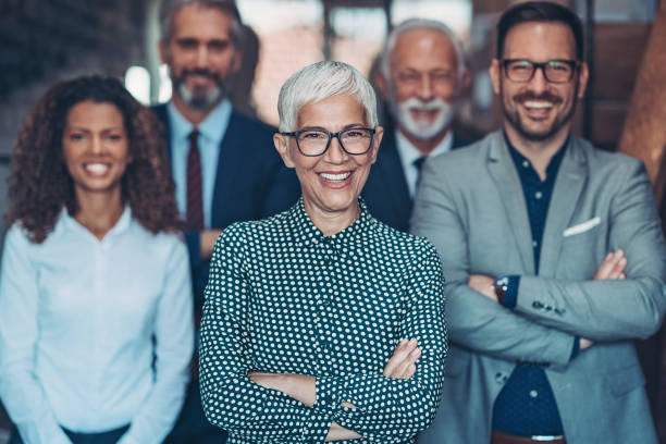 istock Group of smiling business persons 1211604458