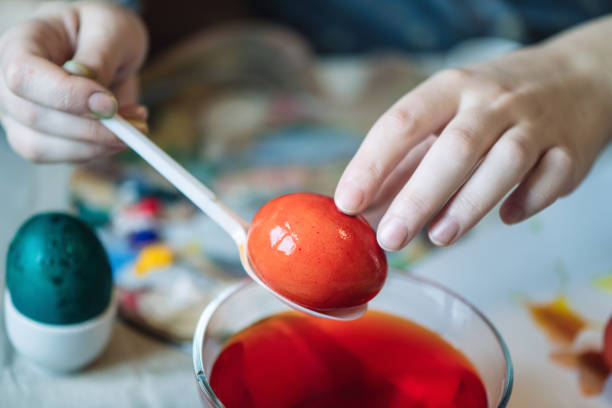 hand painted red sorbian easter eggs and easter decoration on a table