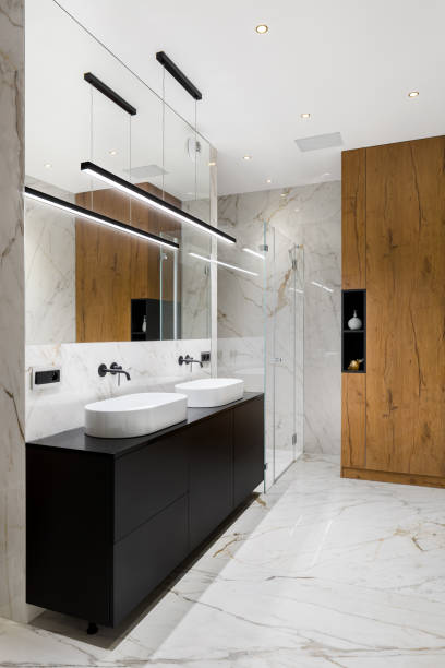 istock Elegant bathroom in white marble tiles 1211606601
