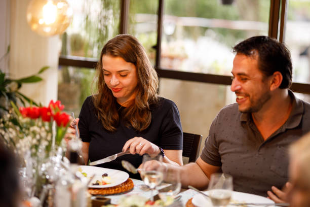 istock Family eating together on table for easter 1211606634