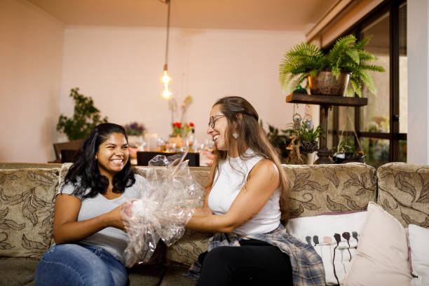 istock Woman giving chocolate easter egg to her friend 1211606656