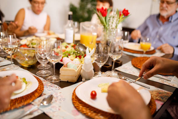 Family eating together on table for easter