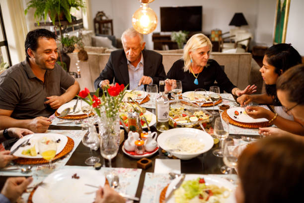 istock Family eating together on table for easter 1211606771
